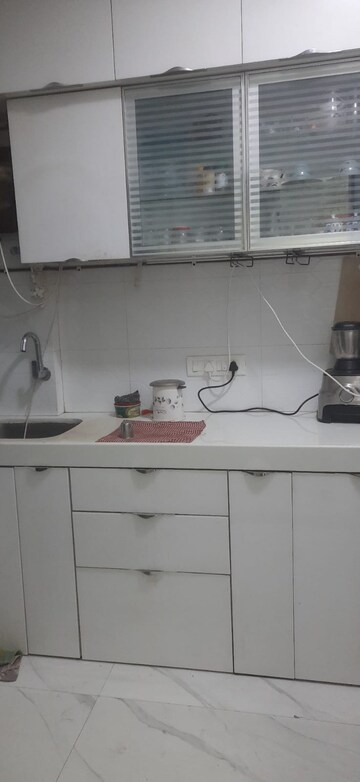 Kitchen in 2 BHK Apartment at Shree Tirupati STG Signature Residency, Patlipada – for Rent