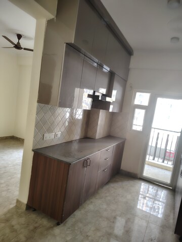 Kitchen in 2 BHK Apartment at Ajnara Le Garden, Sector 16b Greater Noida – for Rent