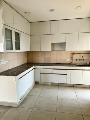 Kitchen in 3 BHK Apartment at Gulshan Bellina, Sector 16 Greater Noida – for Rent