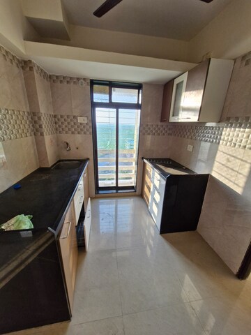 Kitchen in 1 BHK Apartment at Vinay Unique Imperia, Virar West – for Rent