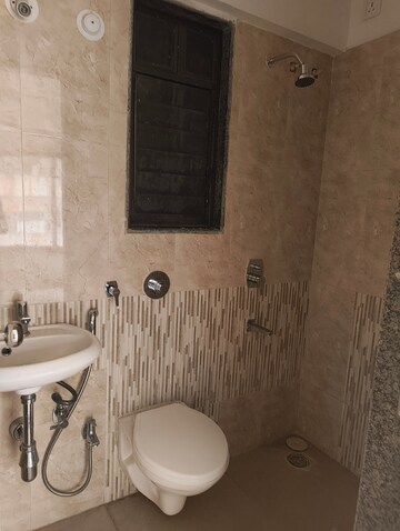 Bathroom in 1 BHK Apartment at BG Shirke Monte Verita, Borivali East – for Rent