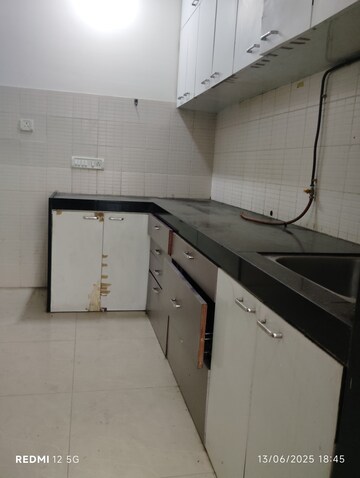 Kitchen in 2 BHK Apartment at DB Parkwoods, Kasarvadavali – for Rent