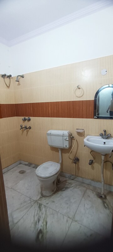 Bathroom in 4 BHK Builder Floor at Virender Nagar – for Rent