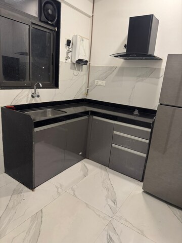 Kitchen in 2 BHK Apartment at Dev Leo Tower, Oshiwara – for Rent