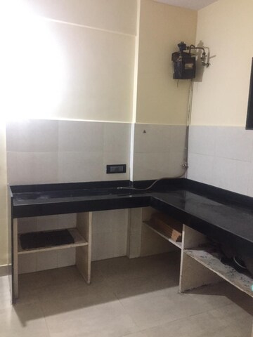 Kitchen in 1 BHK Apartment at Ashoka CHS, Vasant Vihar – for Sale