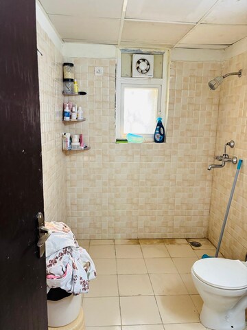 Bathroom in 2 BHK Apartment at Aims Golf City, Sector 75 – for Rent