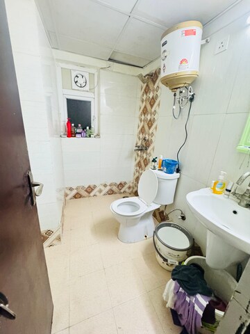 Bathroom in 2.5 BHK Apartment at Aims Golf City, Sector 75 – for Rent