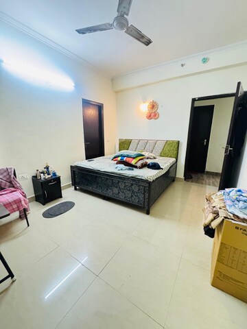 Living Room in 2.5 BHK Apartment at Aims Golf City, Sector 75 – for Rent
