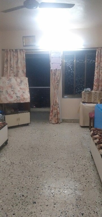 Living Room in 1 BHK Apartment at Takshila CHS, Andheri East – for Sale