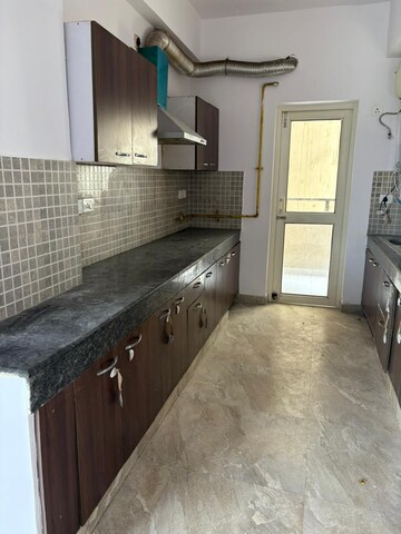 Kitchen in 3 BHK Apartment at Nimbus The Golden Palm, Sector 168 – for Rent