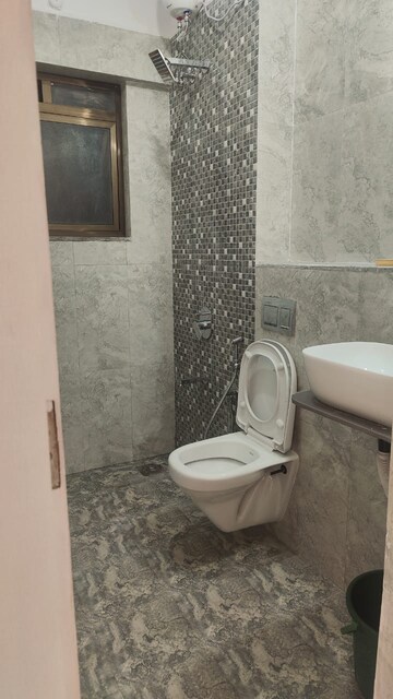 Bathroom in 4 BHK Apartment at Saraswati Vihar – for Sale