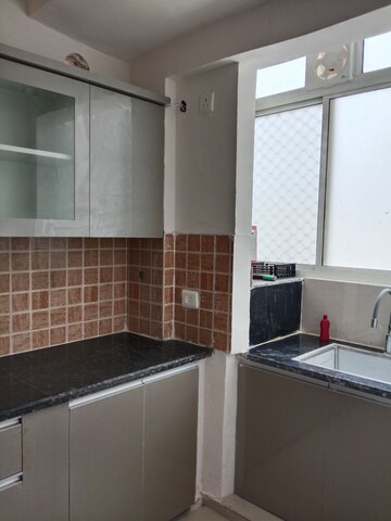 Kitchen in 2 BHK Apartment at Mahagun Mywoods, Sector 16c Greater Noida – for Rent