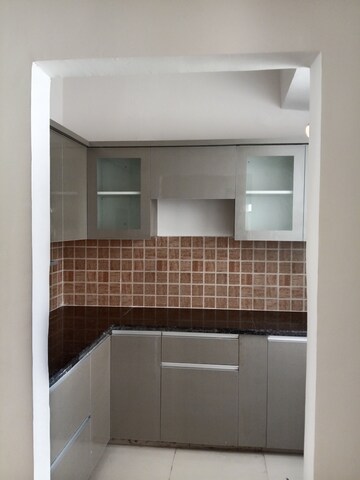 Kitchen in 2 BHK Apartment at Mahagun Mywoods, Sector 16c Greater Noida – for Rent