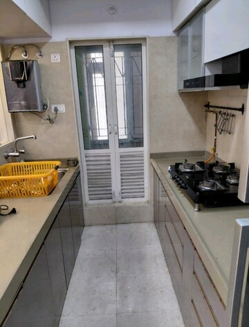 Kitchen in 2 BHK Apartment at Dosti West County, Balkum Pada – for Rent