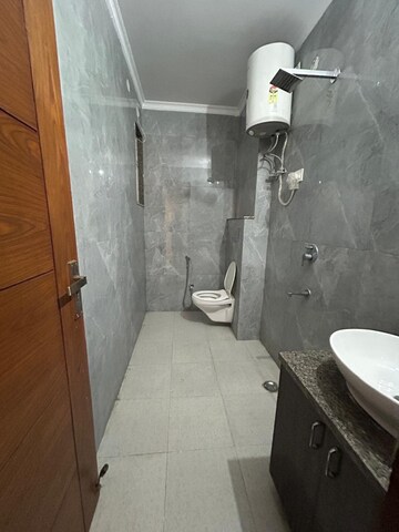 Bathroom in 4 BHK Builder Floor at Freedom Fighters Enclave – for Rent