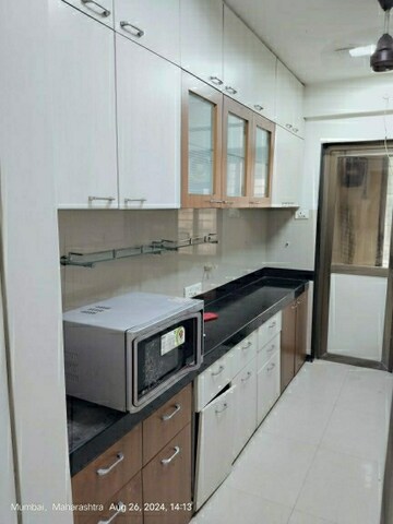 Kitchen in 3 BHK Apartment at Kamanwala Manavsthal II, Goregaon East – for Rent