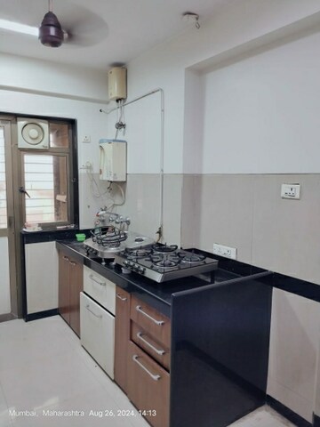 Kitchen in 3 BHK Apartment at Kamanwala Manavsthal II, Goregaon East – for Rent