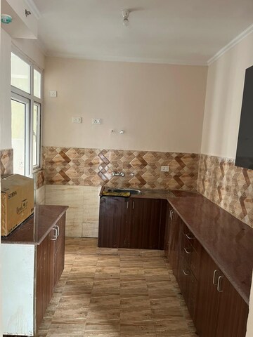 Kitchen in 3 BHK Apartment at Amrapali Golf Homes, Sector 4 Greater Noida – for Rent