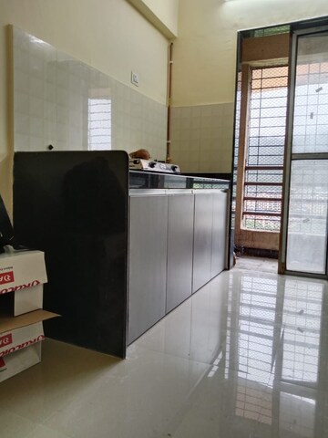 Kitchen in 2 BHK Apartment at Hubtown Greenwoods, Vartak Nagar – for Sale
