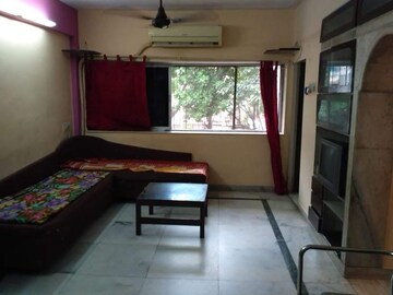 Living Room in 1 BHK Apartment at Juhu – for Rent