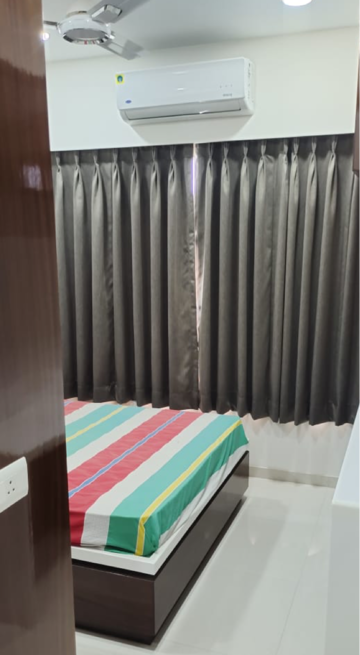 Bedroom in 3 BHK Apartment at Raheja Tipco Heights, Kasam Baug – for Rent