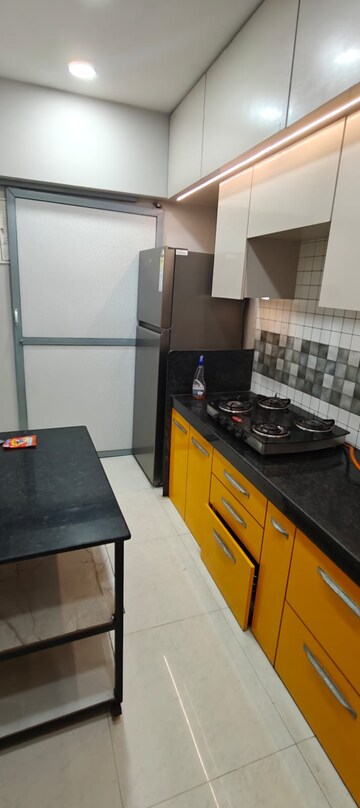 Kitchen in 2 BHK Apartment at Sunteck City Avenue 2, Goregaon West – for Rent