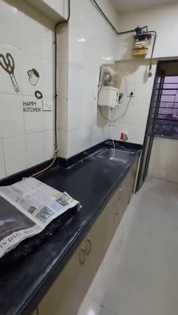 Kitchen in 3 BHK Apartment at Adarsh CHS Andheri, Andheri West – for Rent