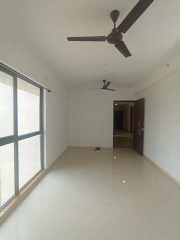 Living Room in 1 BHK Apartment at Lodha Palava Downtown, Dombivli East – for Sale