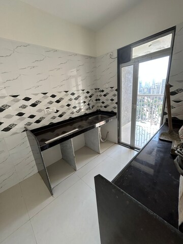 Kitchen in 2 BHK Apartment at Metropolis Rivera, Kasarvadavali – for Rent