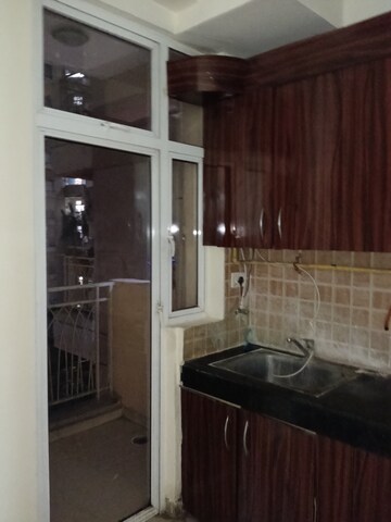 Kitchen in 2 BHK Apartment at Mahagun Mywoods, Sector 16c Greater Noida – for Rent