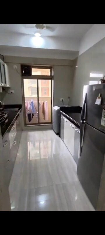 Kitchen in 3 BHK Apartment at Sheth Vasant Oasis, Andheri East – for Rent