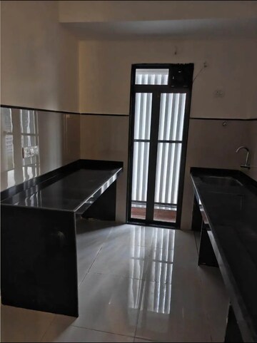 Kitchen in 1 BHK Apartment at Metro Satyam Queens Necklace, Rohinjan – for Sale