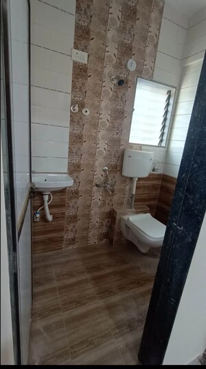 Bathroom in 1 BHK Apartment at Metro Satyam Queens Necklace, Rohinjan – for Sale