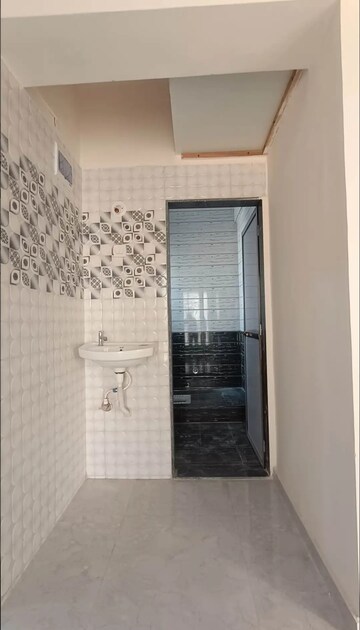 Bathroom in 2 BHK Apartment at Paradise Sai Suncity, Ghot – for Sale