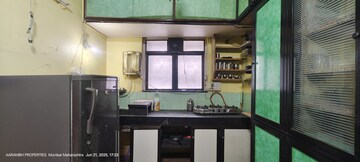 Kitchen in 1 BHK Apartment at Asmita Mogra CHS, Andheri East – for Rent