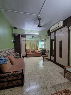 Living Room in 1 BHK Apartment at Chandravadan CHS, Ganeshwadi – for Sale
