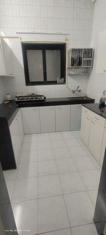 Kitchen in 2 BHK Apartment at Meethi Hill Crest Apartment, Bandra West – for Rent