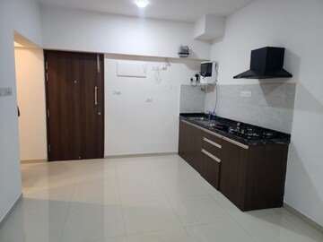 Kitchen in 1 RK Apartment at Gera World of Joy, Kharadi – for Rent