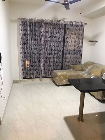 Living Room in 1 BHK Apartment at Lodha Crown Quality Homes, Majiwada – for Rent