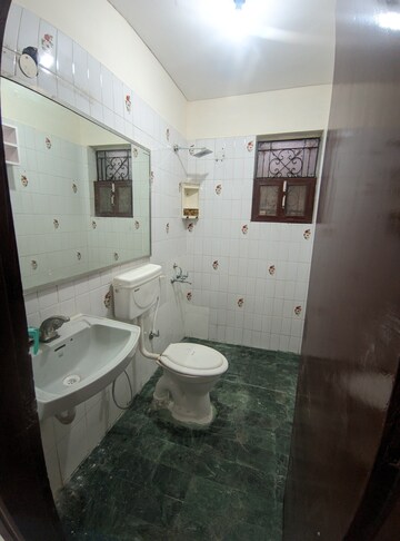 Bathroom in 2 BHK Apartment at Eros Southend Apartments, Charmwood Village – for Rent