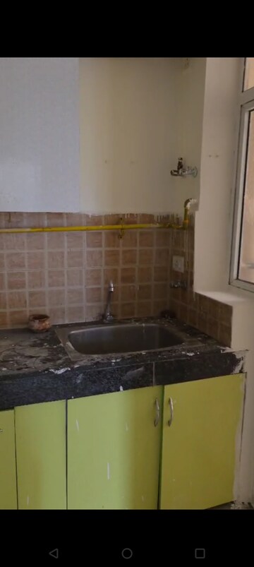 Kitchen in 2.5 BHK Apartment at Mahagun Mywoods, Sector 16c Greater Noida – for Rent