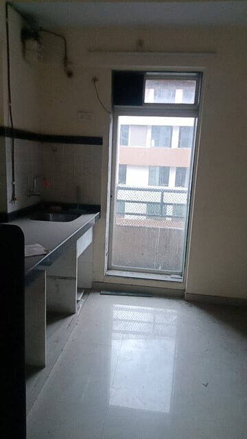 Kitchen in 1 BHK Apartment at Mahavir Kalpavruksha, Ghodbunder Road – for Sale