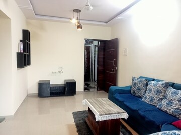 Living Room in 1 BHK Apartment at Salasar Aangan, Mira Road – for Rent