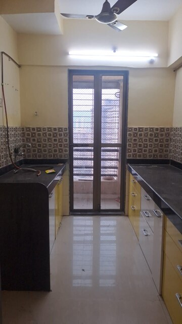 Kitchen in 2 BHK Apartment at Raunak Paradise, Kokanipada – for Rent