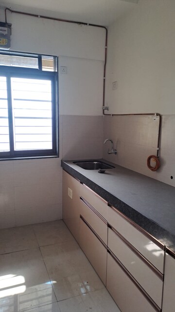 Kitchen in 2 BHK Apartment at Acme Ozone, Manpada – for Rent