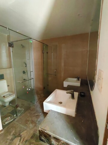 Bathroom in 4 BHK Apartment at Antriksh Golf View, Sector 78 – for Rent