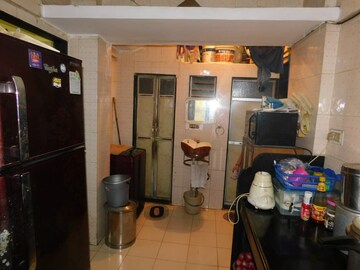 Kitchen in 1 BHK Apartment at Railwaymens Apna Ghar CHS, Jogeshwari East – for Sale