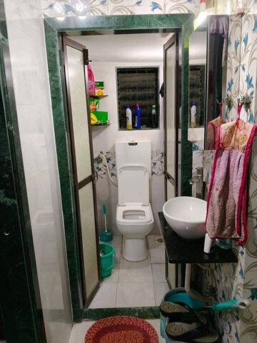 Bathroom in 1 BHK Apartment at Silver Om Yashodhan CHS, Naupada – for Rent
