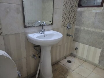 Bathroom in 4 BHK Apartment at Niho Hi Bird Scottish Garden, Ahinsa Khand 2 – for Rent