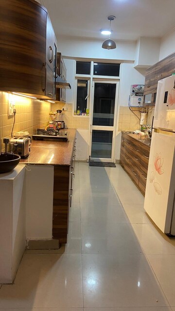 Kitchen in 4 BHK Apartment at Ajnara Gen X, Dundahera – for Rent